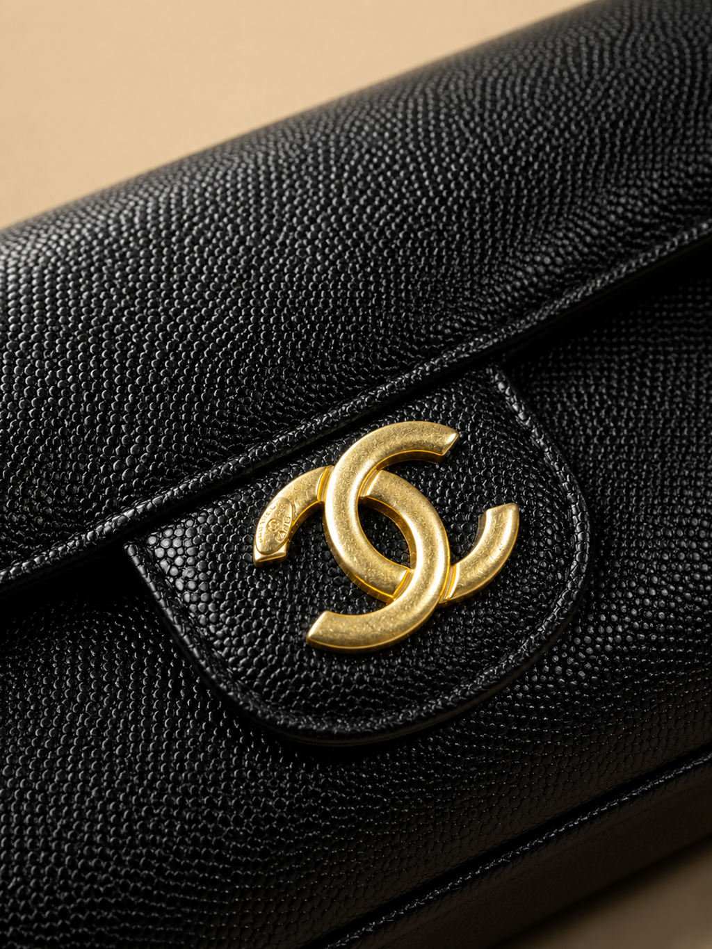 Gold clasp and textured black finish detail