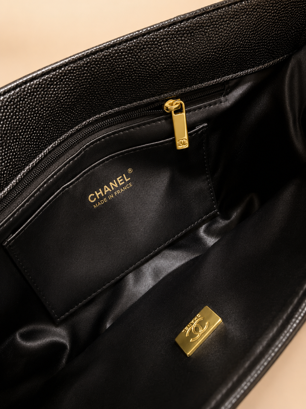 Black interior pocket and gold zipper detail