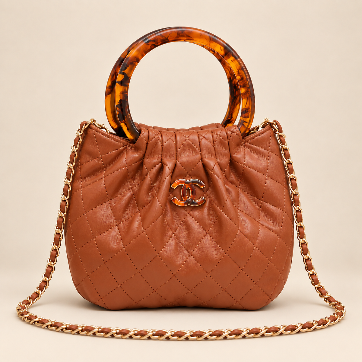 Chanel quilted resin ring top handle bag in cognac